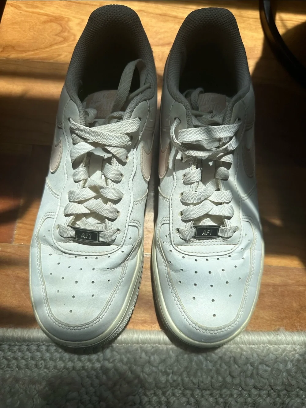 Nike White Low-Top Leather Sneakers with Light Pink Swoosh